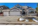 Charming two-story home with a three car garage and manicured lawn at 9647 Colinade Dr, Lone Tree, CO 80124