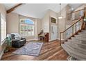 Elegant foyer featuring a staircase, high ceilings, and wood floors at 603 E 2Nd Ave, Castle Rock, CO 80108
