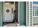 Close up of charming front door with decorative wreath and welcome sign at 603 E 2Nd Ave, Castle Rock, CO 80108