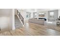 Modern staircase with metal railing leading to the upper level at 3343 S Newcombe St, Lakewood, CO 80227