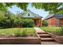Inviting home exterior featuring a brick walkway leading to the front door at 3330 W 30Th Ave, Denver, CO 80211