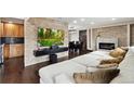 Spacious living room with stone fireplace and large sectional sofa at 11921 W 70Th Pl, Arvada, CO 80004