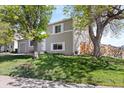 Beautiful two-story home with mature trees, a well-kept lawn, and classic architecture, showcasing curb appeal at 10405 W 107Th Pl, Broomfield, CO 80021