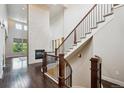 Elegant staircase featuring wood banisters and iron spindles at 2264 S Joyce St, Lakewood, CO 80228
