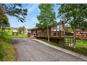 Attractive home with large windows and a spacious deck at 30221 Stagecoach Blvd, Evergreen, CO 80439