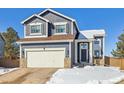 Beautiful two-story home featuring stone accents, an attached garage, and a cozy front entrance at 4241 Brookwood Pl, Highlands Ranch, CO 80130