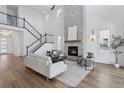 Spacious living room with a fireplace, high ceilings, and a staircase at 81 Simmental Loop, Castle Rock, CO 80104