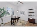 Bright office space with a large window, modern furniture, and stylish decor at 81 Simmental Loop, Castle Rock, CO 80104