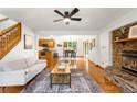An open concept floor plan shows a modern living room with fireplace and hardwood floors at 9633 Fox Valley Dr, Morrison, CO 80465