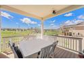 Inviting back porch with outdoor seating offers scenic views of the surrounding park and neighborhood at 1282 Eldorado Dr, Superior, CO 80027