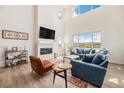 Bright, open living room showcases a fireplace, large windows with views, and comfortable seating at 1282 Eldorado Dr, Superior, CO 80027