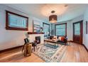 Well-lit living room showcases natural light, decorative fireplace, stylish furniture, and a vibrant rug for a cozy ambiance at 125 E 11Th Ave # 2, Denver, CO 80203