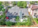 Aerial view of the home's backyard, featuring a patio set and privacy fence at 11788 E Atlantic Pl, Aurora, CO 80014