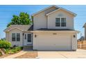 Charming two-story home with a well-manicured lawn and inviting curb appeal at 606 Beth Ave, Fort Lupton, CO 80621