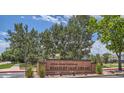 Welcoming brick entrance sign to Standley Lake Library amidst lush green trees and landscaping on a sunny day at 14587 W 90Th Ln # B, Arvada, CO 80005