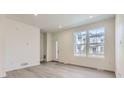 Bright living room featuring modern flooring and natural light at 14587 W 90Th Ln # B, Arvada, CO 80005