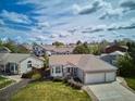 An aerial shot of a single-story home, showcasing its landscaping and neighborhood at 10060 Oak Leaf Way, Highlands Ranch, CO 80129