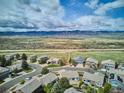 An aerial perspective of the neighborhood, showing its serene surroundings and mountain views at 10060 Oak Leaf Way, Highlands Ranch, CO 80129