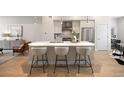 Modern kitchen featuring a large island with seating and stainless steel appliances at 1256 Xavier St, Denver, CO 80204