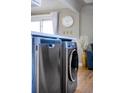 Close up of stainless steel dishwasher and clothes washer in the kitchen at 1421 Jasmine St # 1, Denver, CO 80220