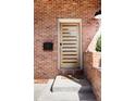 Modern front door with horizontal windows set in a red brick facade at 2931 W 20Th Ave, Denver, CO 80211
