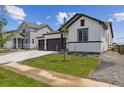 Beautiful single Gathering home featuring a 2 car garage and a small tree in the front lawn at 14390 Heritage Dr, Mead, CO 80504