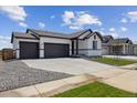 Charming single Gathering home with a spacious 2-car garage and a well-maintained driveway at 14390 Heritage Dr, Mead, CO 80504
