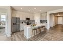 Spacious kitchen with stainless steel appliances, a large center island, and modern cabinetry at 14390 Heritage Dr, Mead, CO 80504