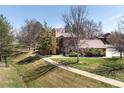 A view of a well maintained home with a sidewalk leading to the front door at 6251 Willow Ln, Boulder, CO 80301