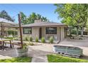 Charming single-story home with a landscaped front yard and patio seating area at 13211 W 32Nd Ave, Golden, CO 80401