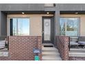 Charming front entrance with brick accents, modern door, and inviting steps at 4072 W 17Th Ave, Denver, CO 80204