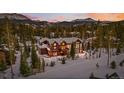 Luxury home nestled in a winter mountain setting at 127 Windwood Cir, Breckenridge, CO 80424