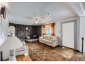 Cozy living room with stone fireplace, comfortable seating, and ample natural light at 828 S Osceola St, Denver, CO 80219