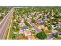 Scenic aerial view showcases the neighborhood's lush greenery and convenient access to major roads at 701 Tucson, Aurora, CO 80011