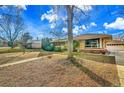 Home exterior with a walkway leading up to it, and a detached garage on the right at 435 Cody Dr, Lakewood, CO 80226