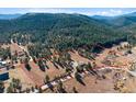 Gorgeous property lot surrounded by mature trees and beautiful mountain views at 87 Elmgreen Ln, Evergreen, CO 80439