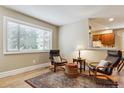 Inviting living room with hardwood floors, a large window, and stylish furnishings at 444 S Larkspur Dr, Castle Rock, CO 80104