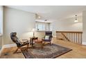 Inviting living room with hardwood floors, a large window, and stylish furnishings at 444 S Larkspur Dr, Castle Rock, CO 80104