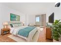 Spacious bedroom with hardwood floors and large window at 1250 N Humboldt St # 1002, Denver, CO 80218