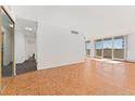 Living room with hardwood floors and access to balcony at 1250 N Humboldt St # 1002, Denver, CO 80218