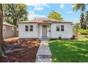 Cozy single-story home featuring a welcoming front porch and manicured landscaping at 4465 N Umatilla St, Denver, CO 80211