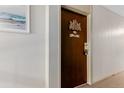 Hallway view of unit door with design and number 308 at 7755 E Quincy Ave # 308A5, Denver, CO 80237