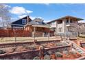 Charming brick home with manicured front yard and black wrought iron fence at 4149 Irving St, Denver, CO 80211
