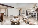 Bright living room with vaulted ceilings, wood beams, and an open floor plan at 19383 E Chaffee Pl, Denver, CO 80249