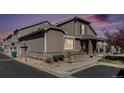 Charming townhome featuring stone accents, well-maintained landscaping, and an attached one car garage at 4739 Raven Run, Broomfield, CO 80023
