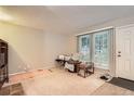 Inviting living room with natural light, neutral walls, and functional layout at 1250 S Monaco Street Pkwy # 49, Denver, CO 80224