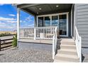 Covered porch featuring neutral seating, providing an outdoor space to enjoy views and relaxation at 3444 Recess Pt, Castle Rock, CO 80108