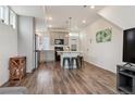 Open-concept kitchen featuring an island with seating, stainless steel appliances, and modern finishes, perfect for entertaining at 4138 N Quatar Ct, Aurora, CO 80019