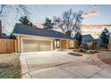 Charming single-story home featuring a landscaped front yard and two-car attached garage at 2867 S Oswego Ct, Aurora, CO 80014