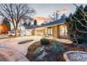 Charming single-story home featuring a landscaped front yard with stone and driveway at 2867 S Oswego Ct, Aurora, CO 80014